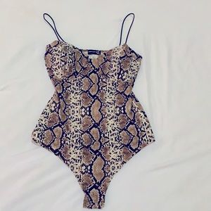 Women’s snake print body suit
